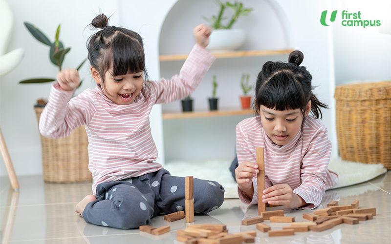 Two Girls Playing In The Studio
