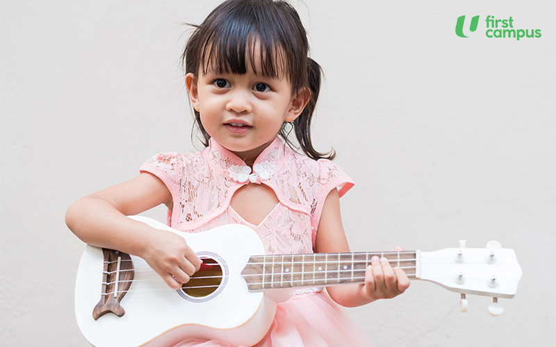 Little Girl Playing Drum at Home