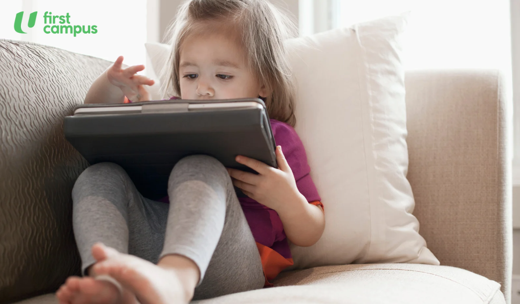 2-3 year old child playing with a tablet. By the age of 2 to 3 years, children in Singapore spend an average of 2.5 hours a day on screens.