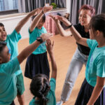 Children in a group setting with guidance from an educator.